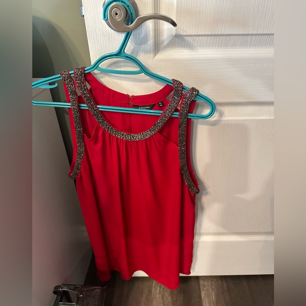 Red glittery blouse